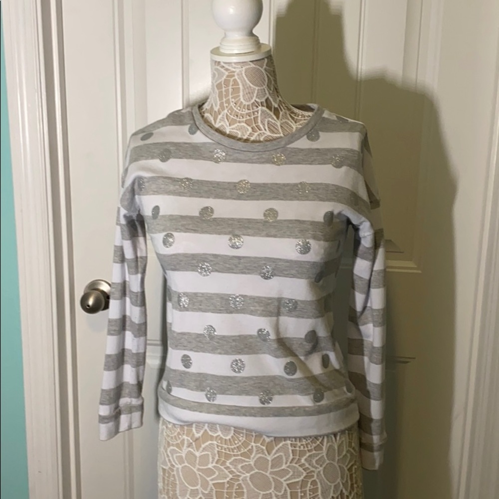 Only the sweater is included.